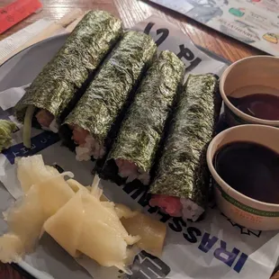 a plate of sushi and a cup of coffee