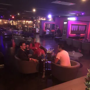 a group of men sitting around a table