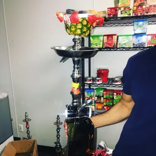 a man holding a hookah