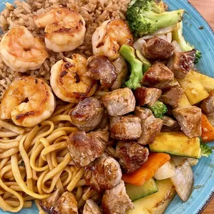 Delicious steak and shrimp hibachi lunch; served with white sauce.