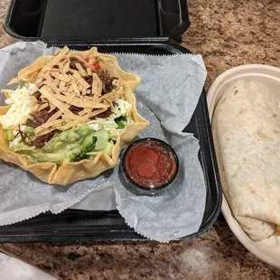 Taco salad with shredded beef and burrito with chorizo