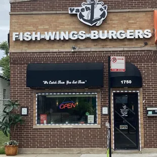 the front of a fish - wings - burgers restaurant