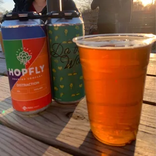 a beer and a can of hoppy