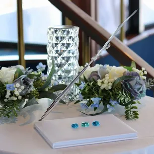  table with flowers and a pen