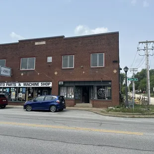 Coffee shop is on the right of this photo. They have some outdoor seating to the right of the building too.