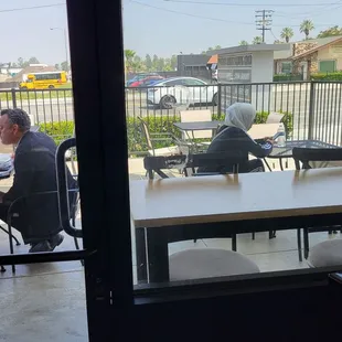 Small patio dining area plus 3 more tables inside