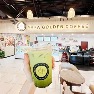 Golden matcha latte with ice and almond milk