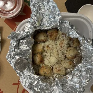 Garlic nuts, quarter for scale.