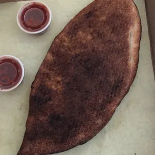 Bottom of burnt calzone.
