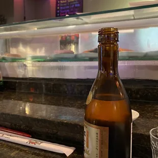 Sitting at the bar.