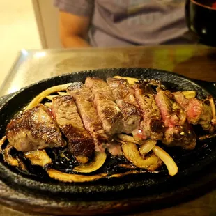 Dinner @Yagura Restaurant; 8/14/2024. Hubby David Ordered, NY Steak (Med. Rare) w/Grilled Onions on their Sizzling Platter.