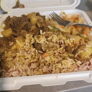 Curry goat rice and peas, cabbage