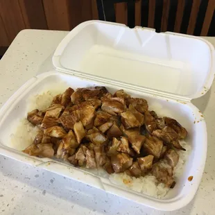 chicken and rice in a styrofoam container