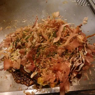 Okonomiyaki on the teppanyaki grill. June 2024.