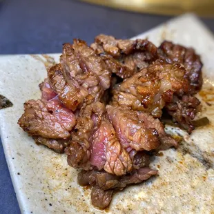 a piece of meat on a cutting board