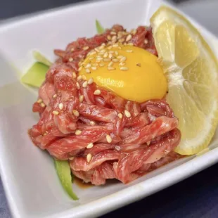 an egg on top of meat