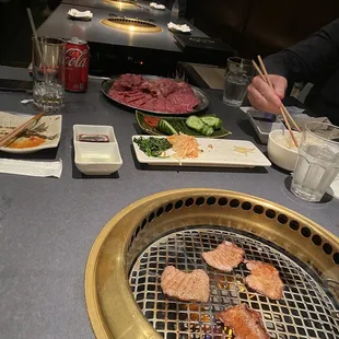 a grill with various types of food on it