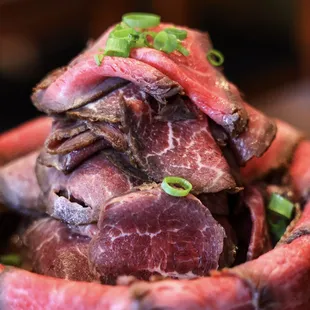 a pile of sliced meat