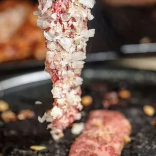 a piece of meat on a fork