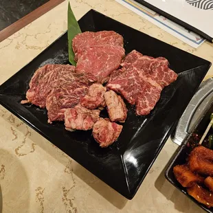 Combination Meat Platter $69.95. 4 types of beef X 4. Outside skirt/ harami, chuck eye roll, rib finger meat and boneless short rib/ kalbi.