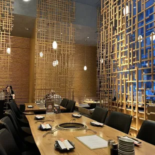 a dining room with a table and chairs