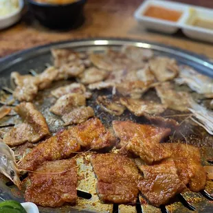 a plate of meat and vegetables on a table