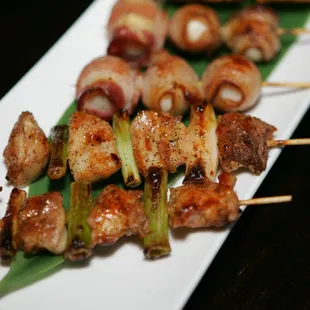 a plate of skewered food