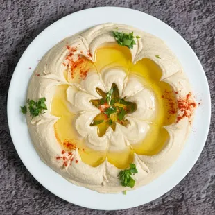 a plate of hummusled hummusle