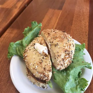 Everything bagel with cream cheese, onion, tomato, and lettuce.