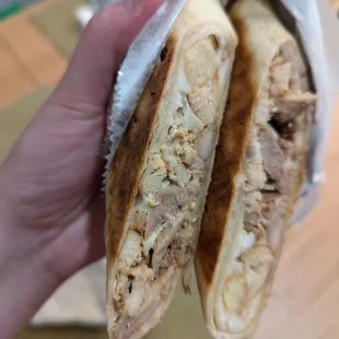 Chicken shawarma wrap- inside is meat, pickles, garlic sauce and fries..bland fries