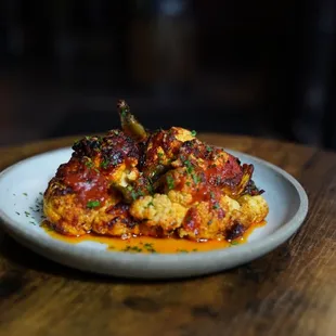 Braised and roasted cauliflower with chili and tomato