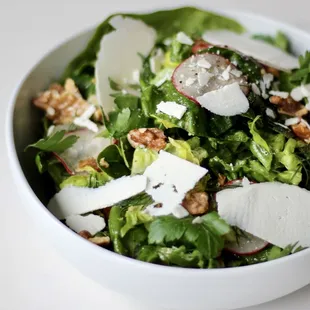 a white bowl filled with a salad