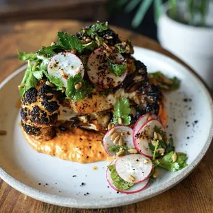 a plate of food on a wooden table