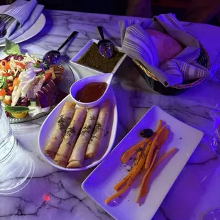 Jibneh rolls, farroush salad, zaatar/oil, pita, carrots/olives