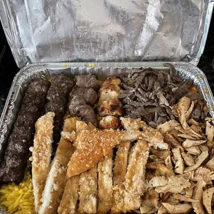 Combo for 3. Beef kabob, chicken kabob, kafta, chicken cream chop, beef and chicken shawarma, rice, and burgal wheat.