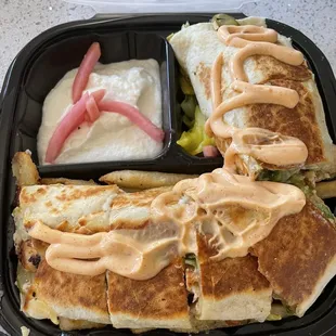Chicken Shawarma combo with garlic and fries.