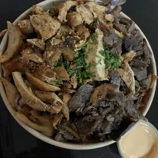 $16.99 mixed shawarma bowl, yallah sauce on the side