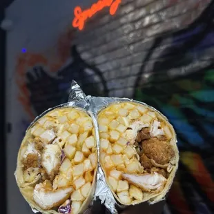 two burritos wrapped in foil