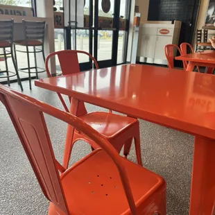 an orange table and chairs