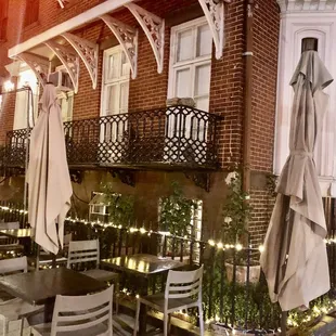 a man standing in front of a restaurant