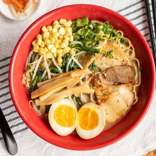 a bowl of ramen noodles with a boiled egg