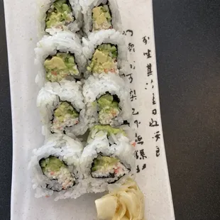 a plate of sushi rolls