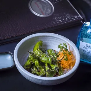 Grilled shishito pepper appetizer. A great pairing with a Junmai Sake