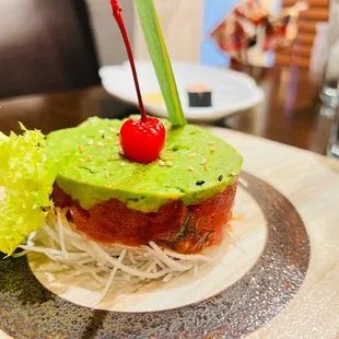 a sushi with a cherry on top