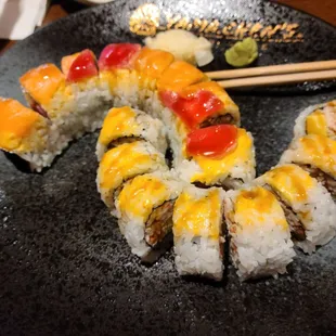 a plate of sushi rolls