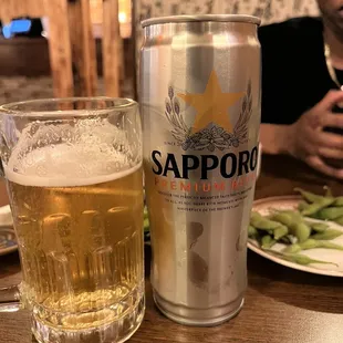 a beer and a plate of asparagus