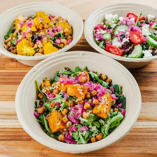 three bowls of salad
