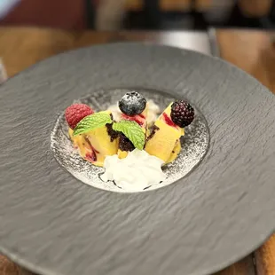 a plate of fruit and yogurt