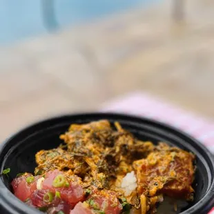 a person holding a bowl of food