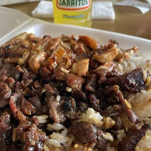 Teriyaki chicken and beef over rice